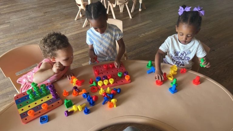 Children building with colorful blocks