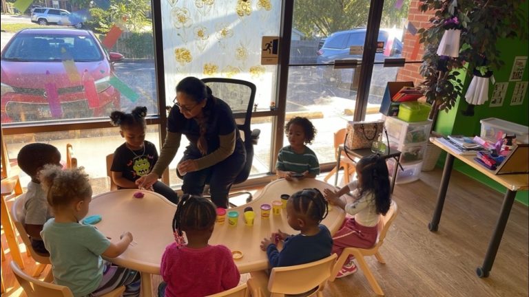 Preschoolers working together at a table in the Dream STEAM Academy Innovation Room